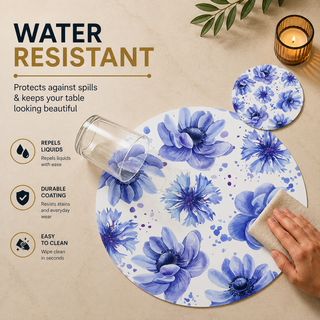 Floral Dreamscape round paper placemat, blue and violet watercolor cornflowers, water resistant surface with liquid beading as a hand wipes it clean, matching coaster alongside