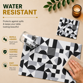 Monochrome Balance rectangular paper placemat, black and white Bauhaus geometric shapes, water resistant surface with liquid beading as a hand wipes it clean, matching coaster alongside