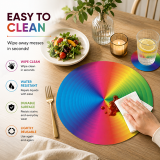 Radiant Disc round paper placemat, full rainbow radial color spectrum, easy to clean as a hand wipes a spill beside a styled place setting