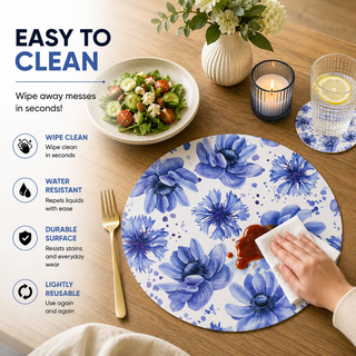 Floral Dreamscape round paper placemat, blue and violet watercolor cornflowers, easy to clean as a hand wipes a spill beside a styled place setting