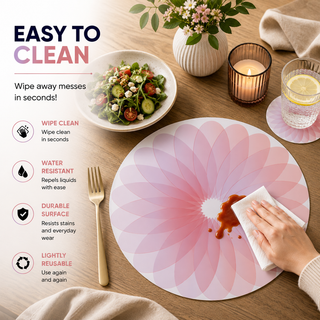 Petal Harmony round paper placemat, blush ombre radiating petals, easy to clean as a hand wipes a spill beside a styled place setting