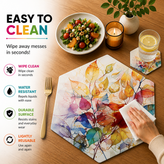 Painted Foliage hexagonal paper placemat, rainbow watercolor autumn leaves, easy to clean as a hand wipes a spill beside a styled place setting