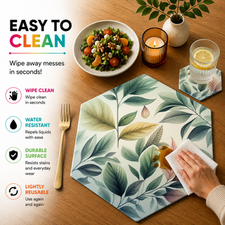 Pastel Foliage hexagonal paper placemat, soft pastel green and pink leaves, easy to clean as a hand wipes a spill beside a styled place setting