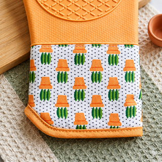 Terracotta heat resistant 550°F silicone oven mitt surface detail with cotton cuff