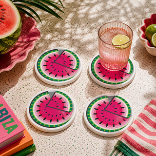 Finished Fruity Palette hand painted ceramic coasters styled with drinks on a table